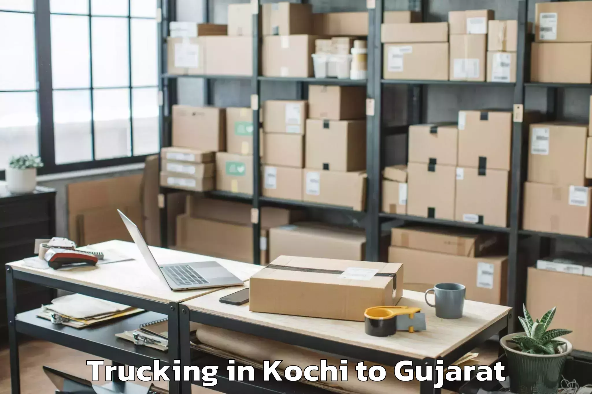 Leading Kochi to Naroda Trucking Provider